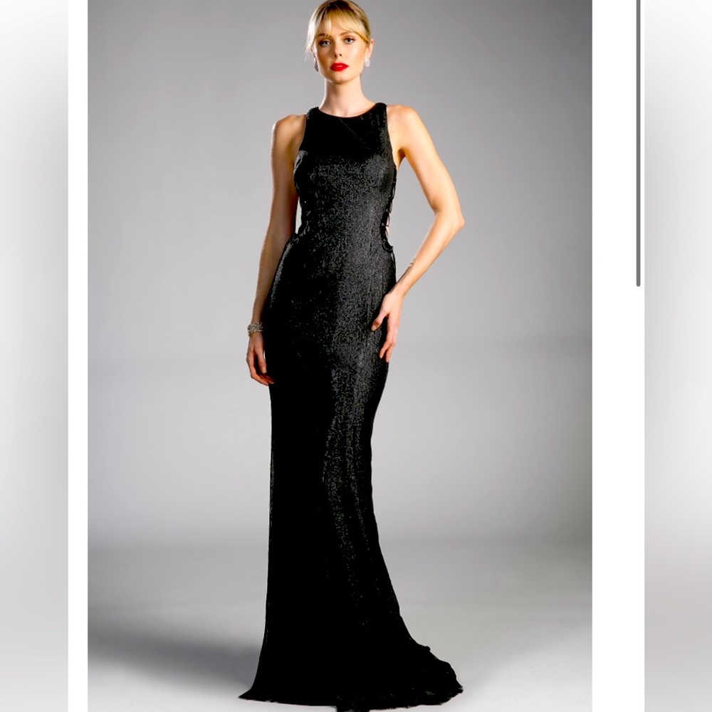 Fitted sequin gown with high neckline and lace up side cut outs.